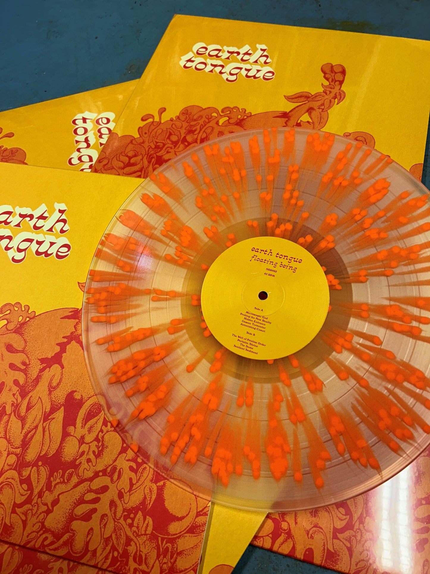 Arcade Sound - Earth Tongue - Floating Being (Orange Splatter on Clear Vinyl Edition) front cover